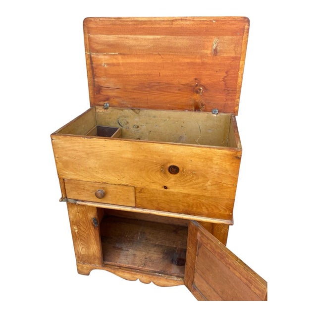 A wonderful example of American country craftsmanship, this antique pine flour bin combines practical storage with...