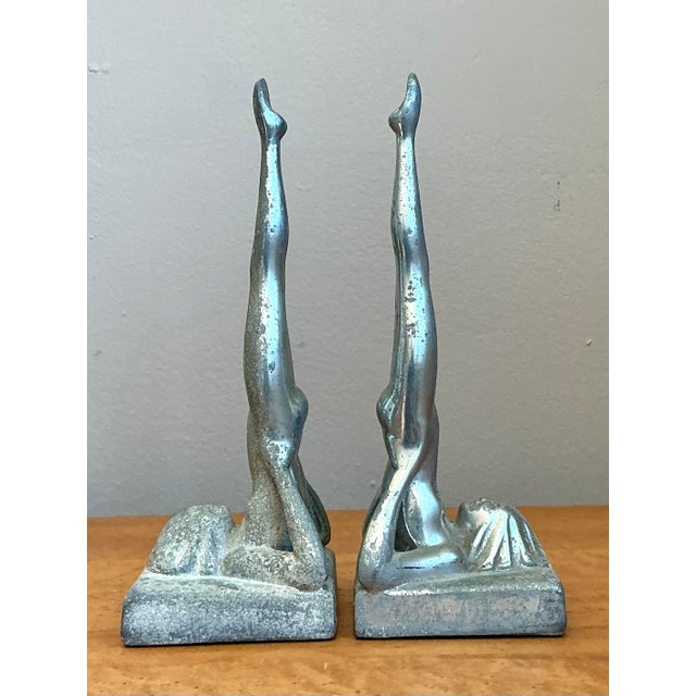 This striking pair of Art Deco revival bookends, reminiscent of the iconic Sasparilla and Frantart designs, represents a...