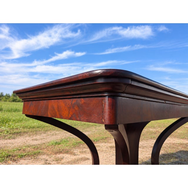 Large Biedermeier wooden table, dating from the 19th century (circa 1830–1840), crafted from mahogany. Solid construction...