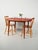 Swedish teak dining table from the 1960s, square with rounded edges, tapered legs, and a simple design. with original AB...