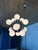 An iconic 1970s Mid-Century Modern Sputnik chandelier by Lightolier, featuring twelve radiating chrome arms fitted with...