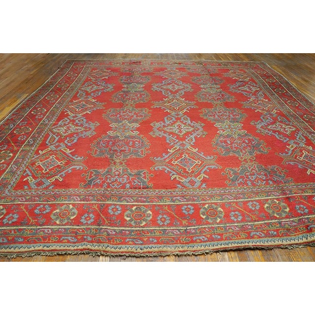 Antique Turkish decorative Oushak rug, size: 12'1" x 13'9". Antique Oushak Turkish Coral 1900s Rug, Circa Date: 1900s....