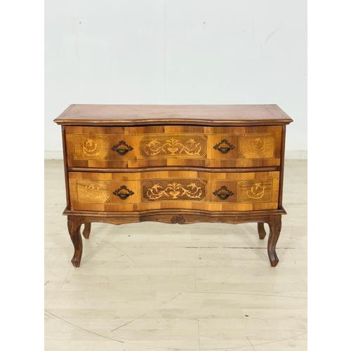 Stylish vintage chest of drawers in the Baroque style. This piece of furniture impresses with its decorative inlays,...