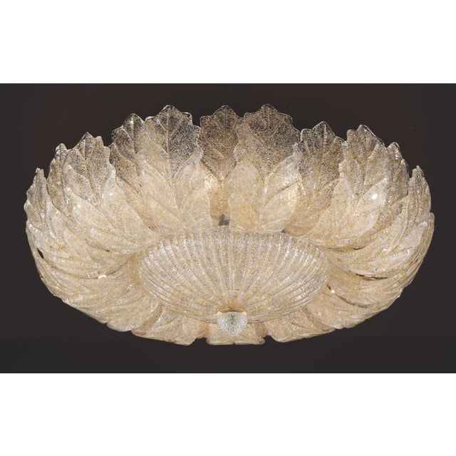 Italian flush mount with clear Murano glass leaves hand blown in amber Graniglia to produce a granular textured effect in...
