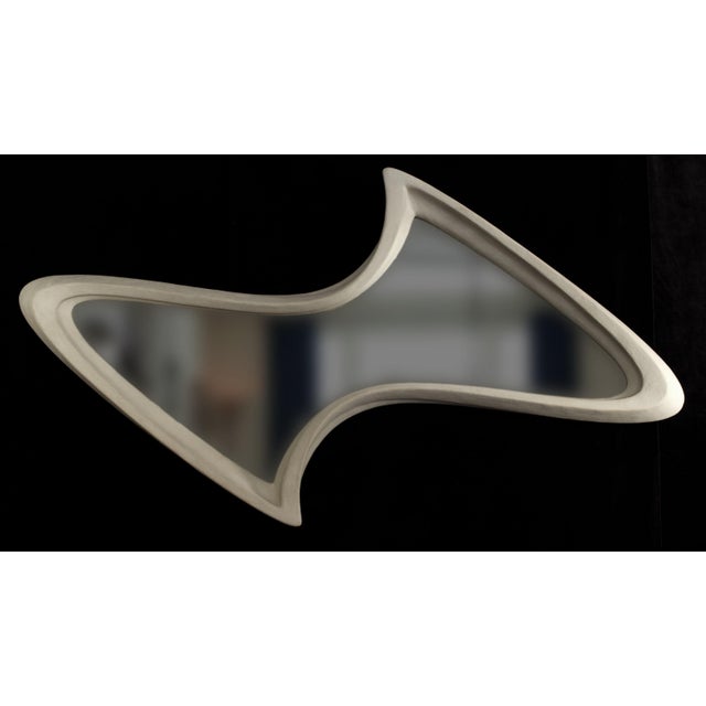 Mirror No. 5 is a large-scale wall-mounted mirror object designed by Chris Delmar. Its broad horizontal form combines a...