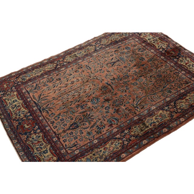 Hand-knotted in wool, this 4x5 antique Persian Kashan rug features a rare design with floral patterns, cartouches in the...