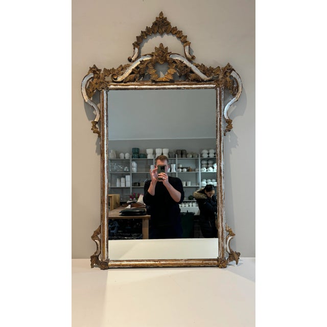 Large Antique Carved Giltwood Mirror. Silver and Gold gilded carved frame.