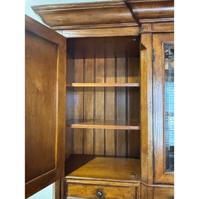 Beautiful and substantial Sligh executive desk with coordinating glass-front display hutch, model 3055-1-ML. This...