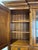 Beautiful and substantial Sligh executive desk with coordinating glass-front display hutch, model 3055-1-ML. This...
