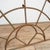 An antique curved cast iron window frame. The metal has rusted over time giving it lots of character and patina, there is...