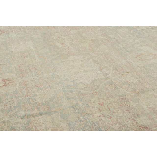 This oversized 12x14 antique Persian Kerman rug is a handwoven wool carpet dating to circa 1910–1920. The rug features an...