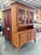 A beautifully crafted two-piece china cabinet from Ethan Allen’s Country Crossings collection, showcasing solid maple...