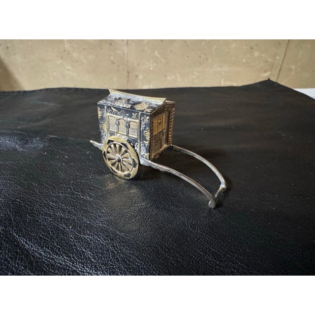 Antique Japanese Sterling Rickshaw Salt & Pepper Shakers. Signed. 24g. Dimensions:2.75”w x1.25”h x0.75”d