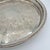 An exuberantly detailed vintage silverplate serving tray by F.B. Rogers, with a richly worked field of scrolling foliage,...