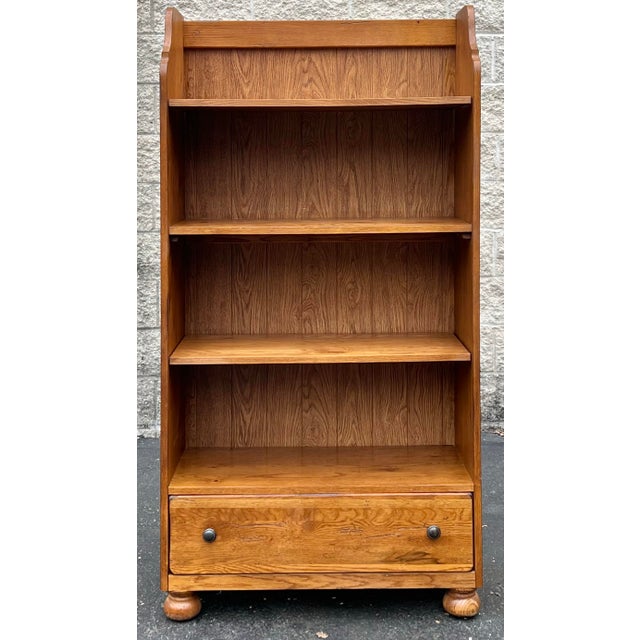 Farmhouse style rustic oak bookshelf by Broyhill from their popular Attic Heirlooms Collection. Made in the USA. Features...