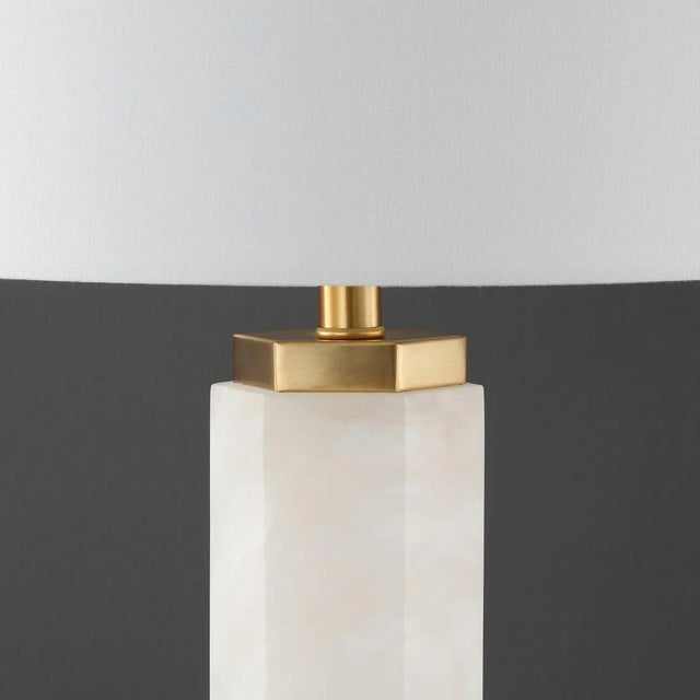 Illuminate your space with the Lynsey alabaster table lamp, a blend of classic design and modern elegance. This lamp...
