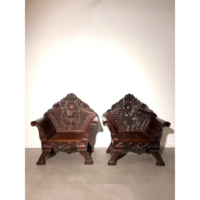 Impressive antique armchair featuring exceptionally detailed hand-carved decoration throughout. The high, sculptural...