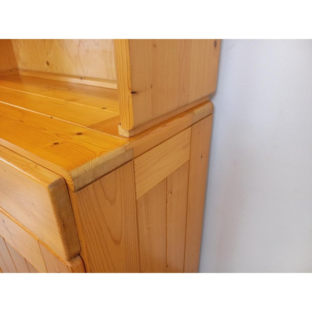 Vintage china cabinet type storage unit from the 60s and 70s, in pine, by Charlotte Perriand for Les Arcs, 4 sliding...