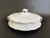 An antique oval covered serving dish in the Hudson All White pattern by Homer Laughlin. This elegant piece features...