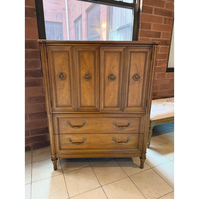 Vintage Henredon Fine Furniture Louis XVI / French Neoclassical Revival armoire, dating to approximately the 1960s, with a...