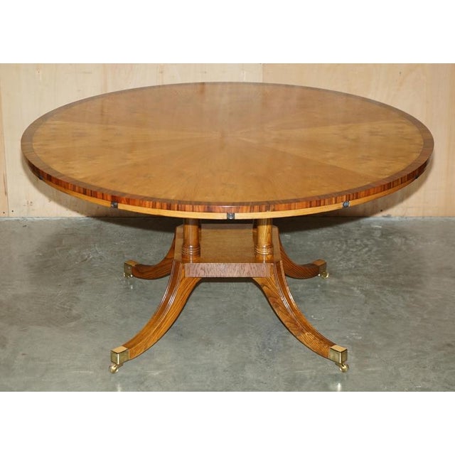 Burr & Burl Oak Jupe round extending dining table that seats up to 10 people. This table is as mentioned brand new, this...