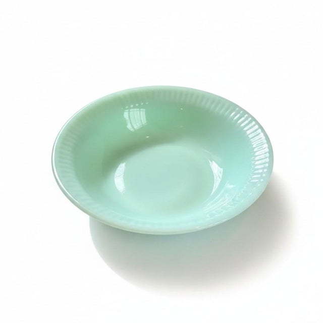 Bring timeless mid-century charm to your table with this set of seven authentic Anchor Hocking Fire-King Jadeite dessert...
