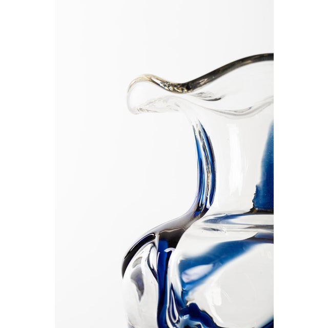 Sinuous vase is an original decorative object realized in Austria in the 1950s. Very beautiful glass vase with decoration...