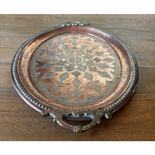 An object made to be carried into a room with purpose. This antique English copper tray is generously scaled and...