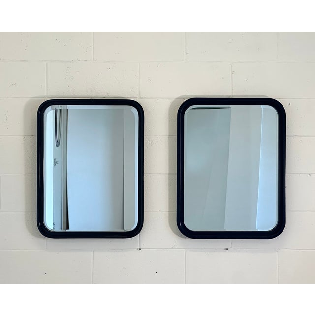 2 mirrors from the 70s, blue lacquered wood, beveled mirror, the two mirrors are not identical, one measures 56.5x73.5...