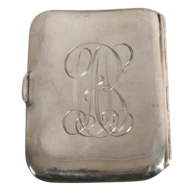 This exceptional antique sterling silver cigarette case by the renowned Unger Brothers showcases the firm's extraordinary...