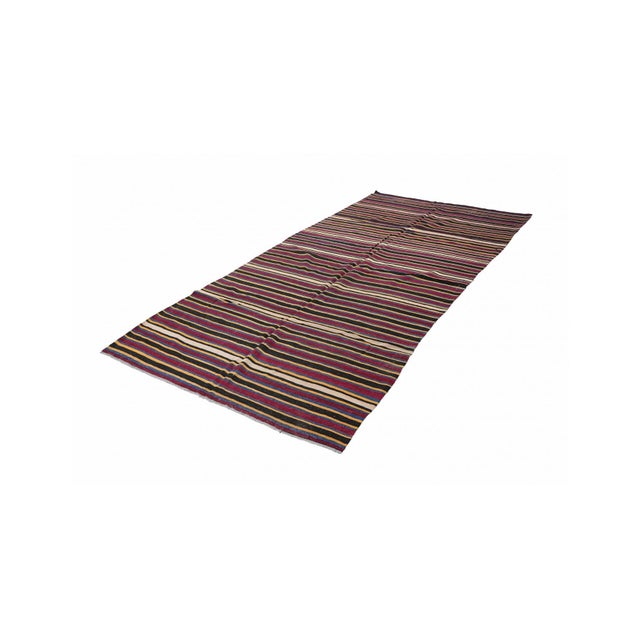Handwoven vintage striped decorative kilim rug from Denizli region of Turkey. Approximately 50-60 years old. In very good...