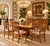 Beautiful set of six vintage Italian-made dining chairs featuring an elegant French Country design with intricately carved...