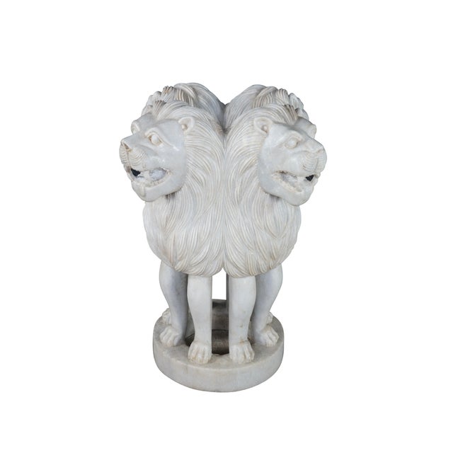 This hand-carved white marble sculptural pedestal or table base is designed in the style of the historic Lion Capital of...