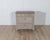 A refined Gustavian-style chest of drawers from Sweden, crafted in pine and painted in warm contrasting tones. The...