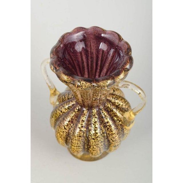 Murano Vase with handles, 1960s. Decorative Murano vase with ribbed body, two clear applied handles and gold dust...