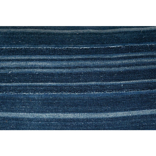 Large size faded indigo tone-on-tone stripe lumbar cushion made from vintage handwoven and hand-dyed slubby cotton fabric....