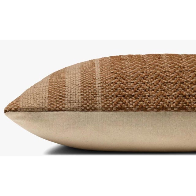Amber Lewis accent pillow in brown. Hand woven construction with 100% cotton material. Includes down insert. Technical...