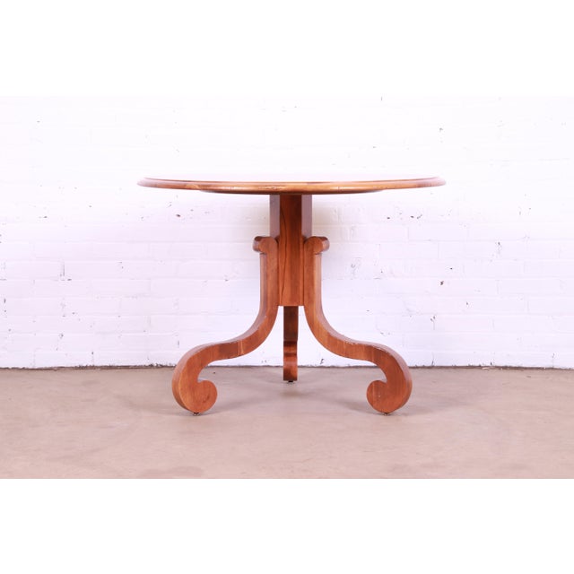 A gorgeous French Empire style fruitwood pedestal breakfast table or center table By Baker Furniture, "Milling Road"...