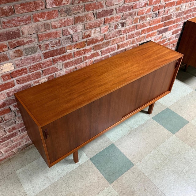 Vintage 1960s mid-century modern teak sideboard or credenza manufactured by Ulferts Möbler of Tibro, Sweden. Features two...