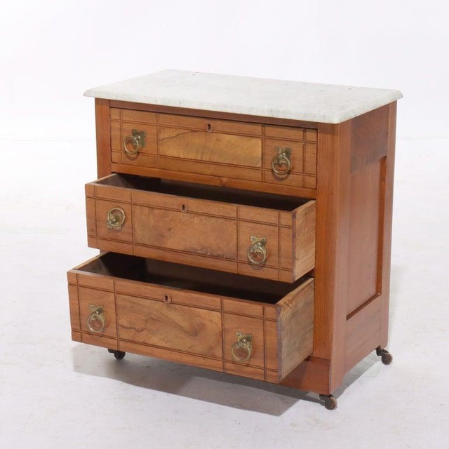 Antique Eastlake Walnut & Burl Three Drawer Marble Top Commode C1890 Measures - 28"H x 27.25"W x 15.25"D An Eastlake...