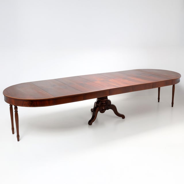 This exceptional Biedermeier dining table , crafted in Germany in the 19th century, is a superb example of of timeless...