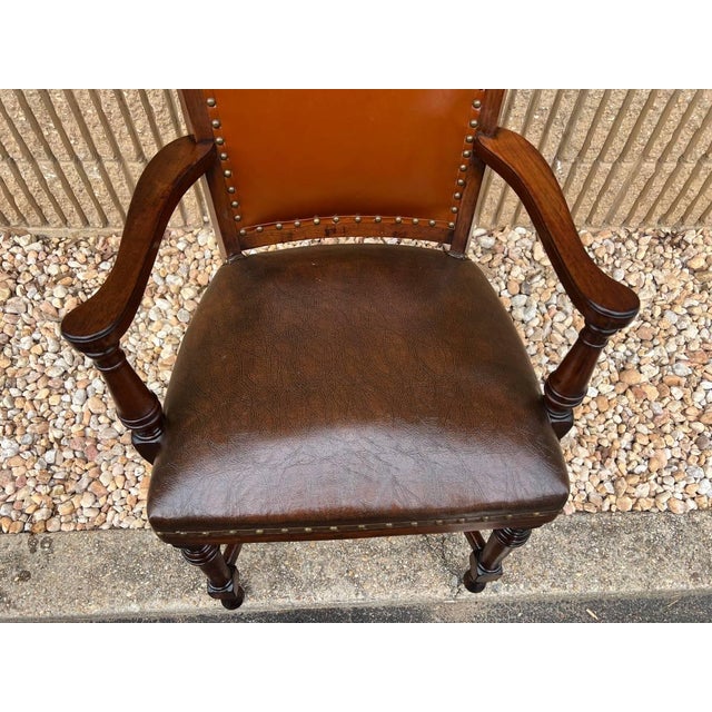 Antique Oak Banker Office Desk Chair. Upholstered with a rich brown leather and brass nailhead trim. American crafted...
