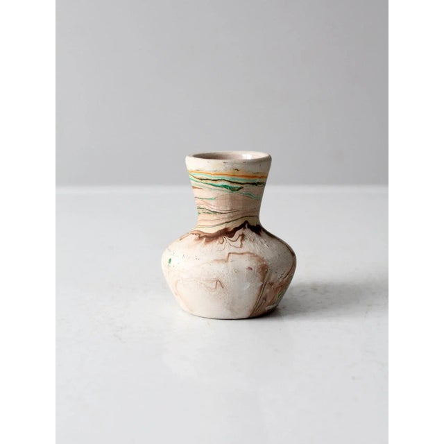 This is a Nemadji Pottery vase circa 1950s. The clay vase features turquoise, brown and orange tones. In the mid 20th...