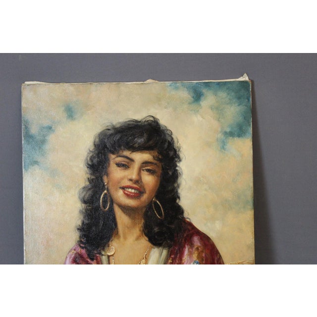 Oil on canvas depicting a woman with a bouquet of flowers, wearing a gold pendant necklace, signed lower right, 20th...