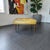 Add a pop of authentic mid-century charm to your living space with this rectangular vinyl ottoman footstool manufactured...