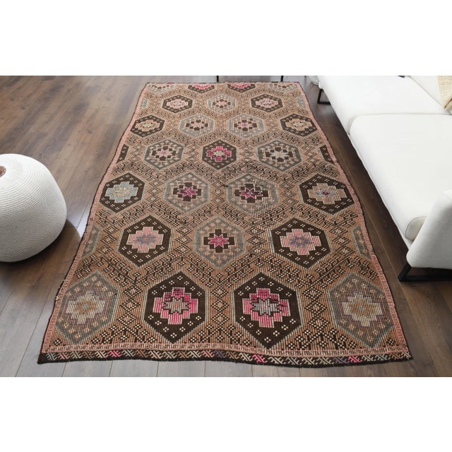 Vintage Turkish Hand-Knotted vintage rug is a semi-antique vintage area rug.'70s Eastern region of Turkey's unique rug is...