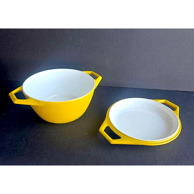 Offered is a quintessential mid 20th century D1 Dutch Oven and lid designed by Michael Lax for Copco in the 1960s. This...