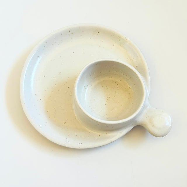 A vintage mid century handmade pottery chip and dip tray. Features a bowl formed off to one side with a handle. Beautiful...