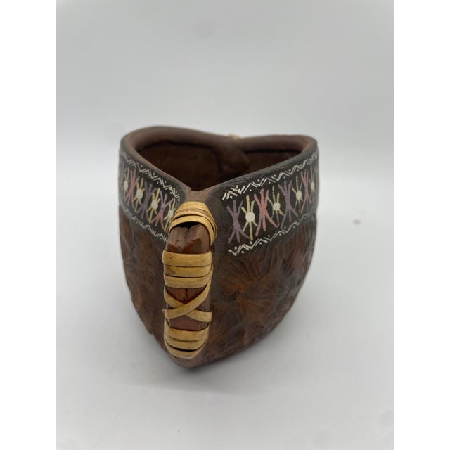 Embrace the cultural heritage and artistry of the Nez Perce Tribe with this captivating pottery cup. Crafted with...