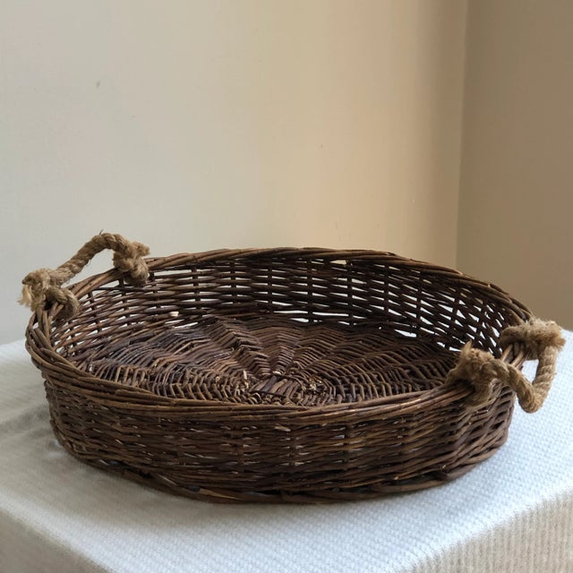 A large and beautiful vintage Adirondack-style twig basket walled tray with aged rope handles. The perfect centerpiece or...